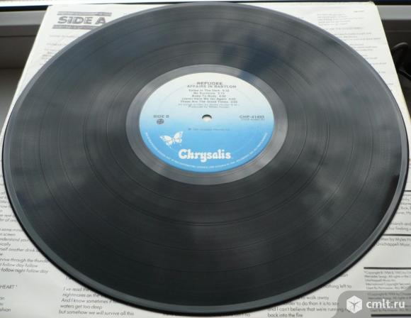 Грампластинка (винил). Гигант [12" LP]. Refugee. Affairs In Babylon. (C)(P) 1985 Chrysalis Records.. Фото 8.
