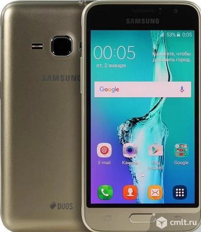 Как новый, 4.5" Смартфон Samsung SM-J120F Galaxy J1 8 ГБ золотистый. Фото 1.