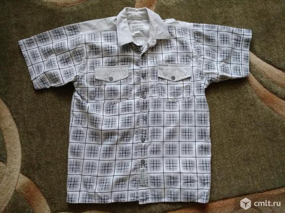 Рубашка подростковая в клеточку с коротким рукавомВоротник: 37 см,длина: 66 см.