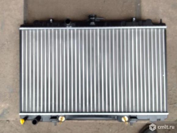 Радиатор охлаждения Ниссан Авенр, Вингроуд 21410WA000. Фото 1.