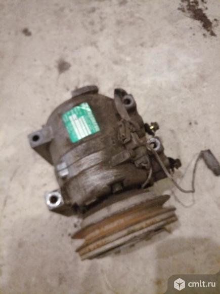 Компрессор кондиционера для Киа спортейдж 1. Фото 1.