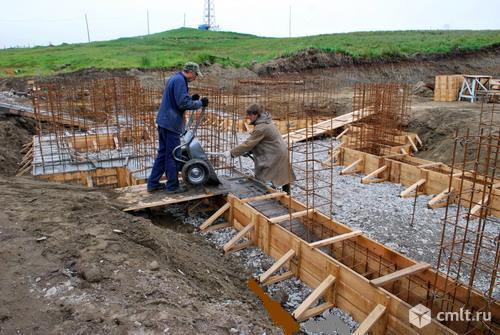 Бетонщик-строитель. Фото 1.