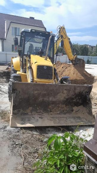 Аренда экскаватора-погрузчика NEW HOLLAND. Фото 1.