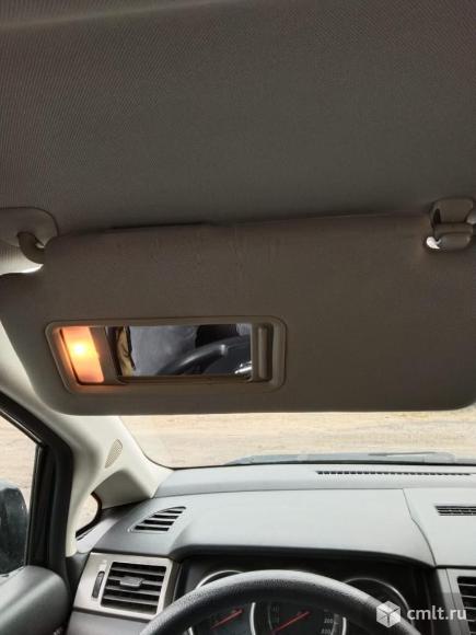 Противосолнечный козырёк для Ниссан Тиида (левый). Фото 1.