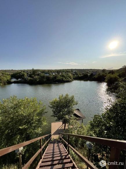 Дом на пруду с пирсом 180 м2 на участке 5.8 сот.. Фото 1.