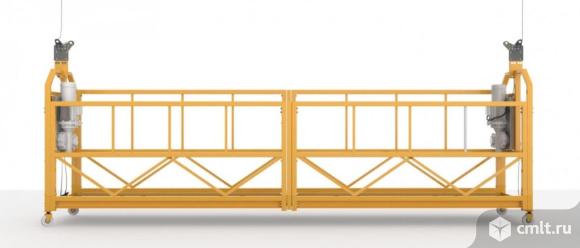 Фасадный подъемник ZLP 630 (Люлька строительная). Фото 1.